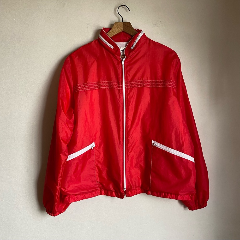 red and white windbreaker jacket